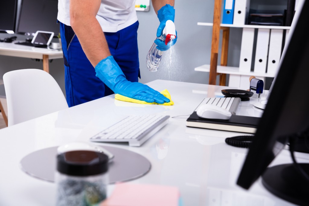 Janitor,Cleaning,White,Desk,In,Modern,Office