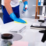 Janitor,Cleaning,White,Desk,In,Modern,Office